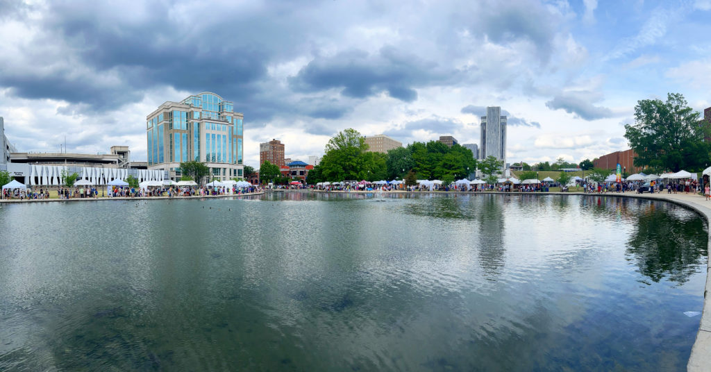 Panoply art festival photo of the artist booths as seen across the lake