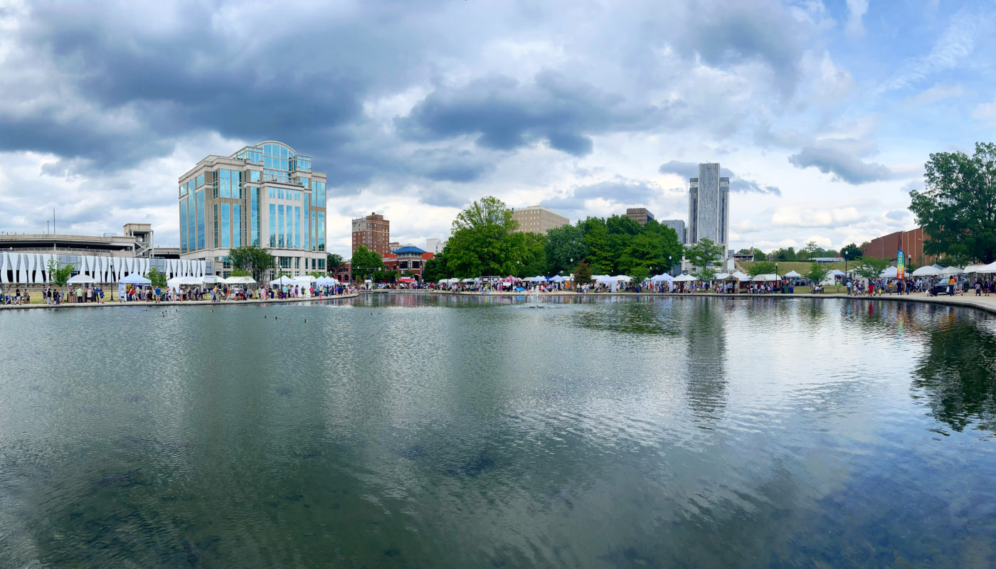 Panoply art festival photo of the artist booths as seen across the lake