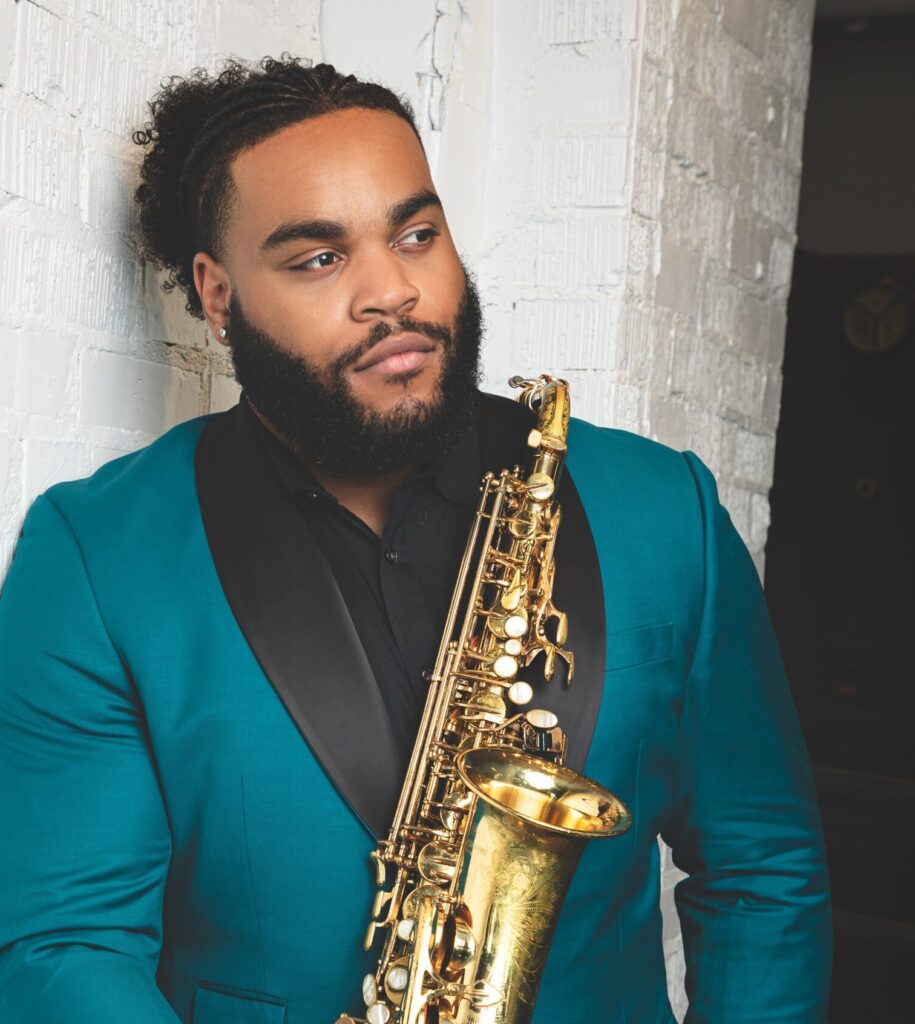 Alex Banks photo holding his saxophone