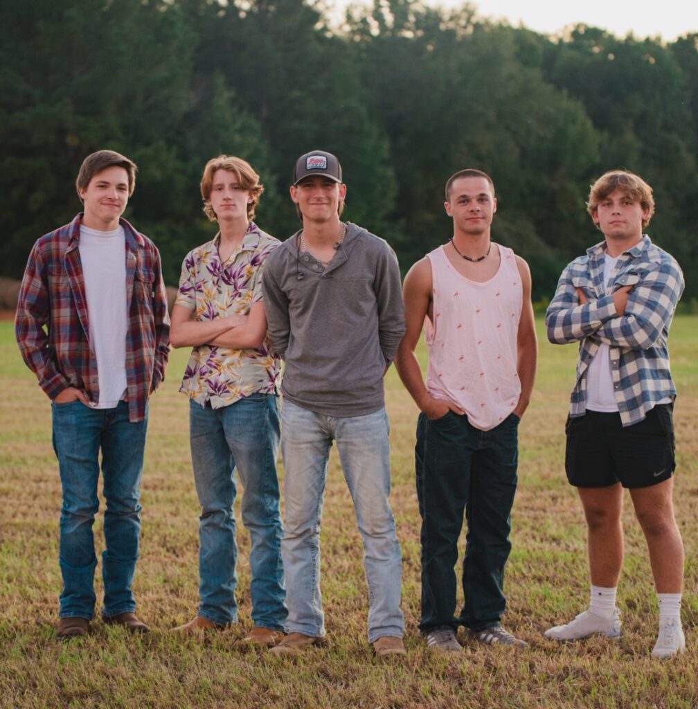 Jackson Chase band members standing in a field