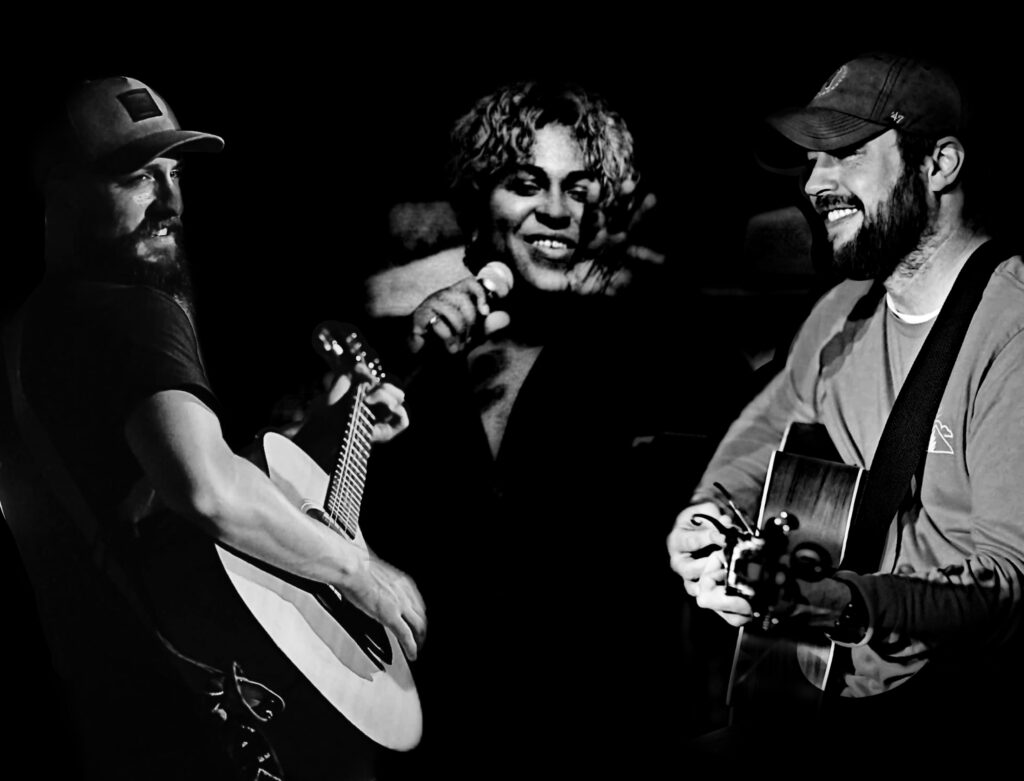 Trick Zipper Trio band performing photo is in black and white