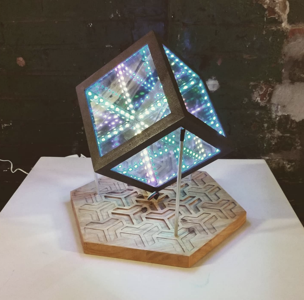 A cube lit with LED lights.