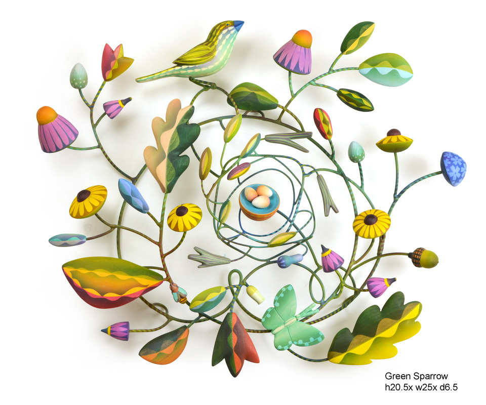 Colorful wooden birds and flowers on steel armatures.