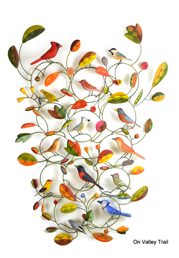 Colorful wooden birds and flowers on steel armatures.