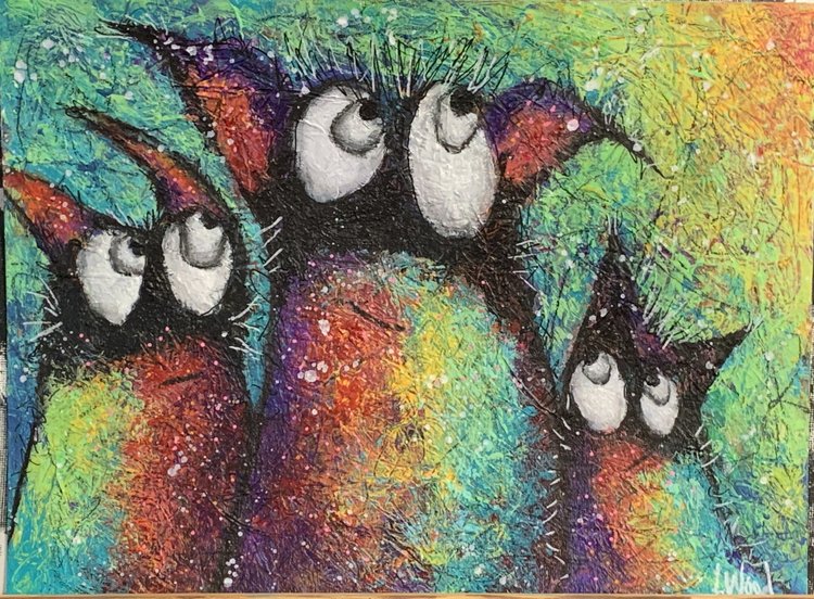Mixed media monsters on paper with a colorful background.