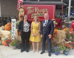 Ann Steverson at the grand opening event with Kroger personnel.