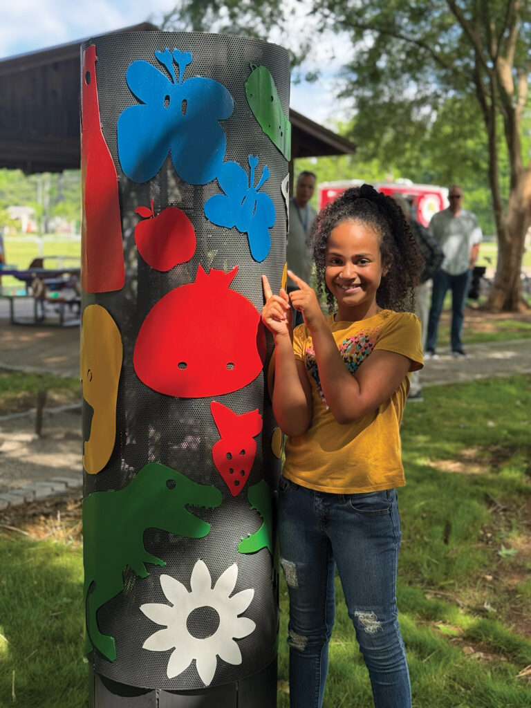 Nora Ward, a student from Challenger Elementary, is one of the artists that contributed to 'Community Pillars'